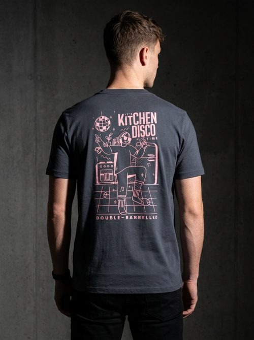 Model wearing a Double-Barrelled Kitchen Disco screen-printed t-shirt back graphic against a concrete wall
